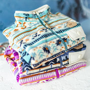 Veste en polar turquoise à motifs hivernaux, bébé || Turquoise patterned vest in fleece, baby