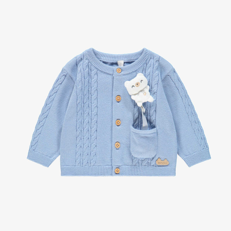 Cardigan bleu en tricot, naissance