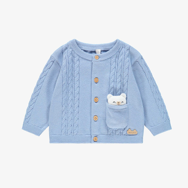 Cardigan bleu en tricot, naissance