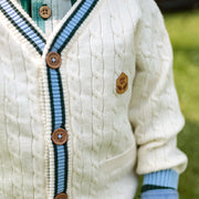 Détails du cardigan en tricot crème avec torsades verticales, bébé