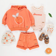 Bonnet crème avec motif d'oranges en tricot côtelé de coton biologique, naissance