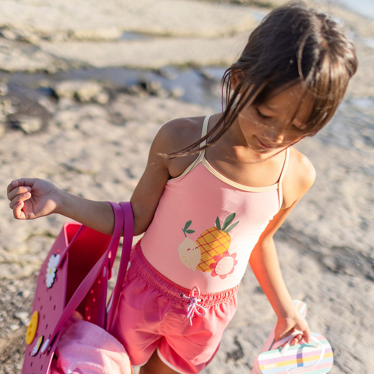 Maillot de bain une pièce rose réversible jaune à motifs de fruits, enfant
