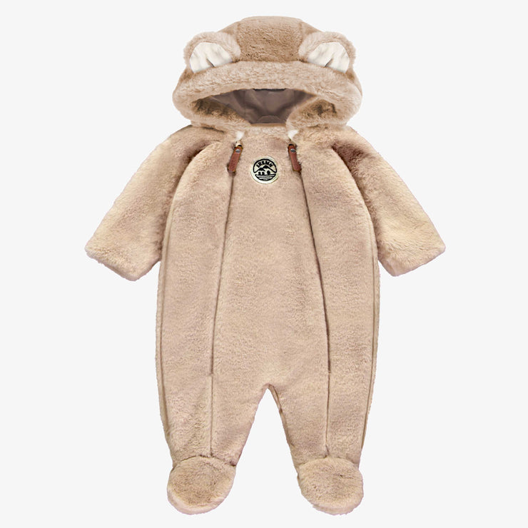 Une pièce beige en fausse fourrure, naissance