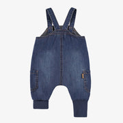 Salopette bleue en denim, naissance