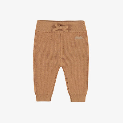 Pantalon beige en tricot, naissance