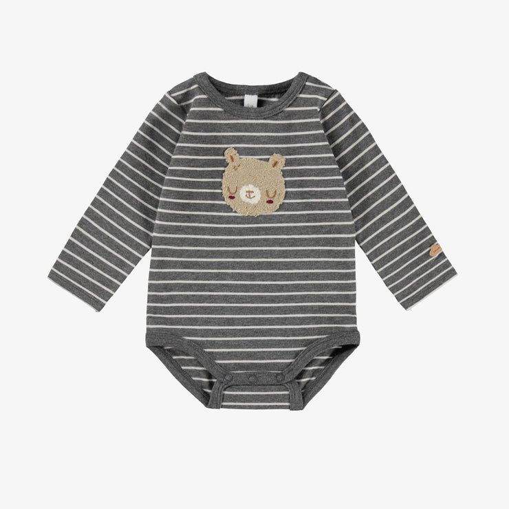 Cache-couche gris à rayures, naissance