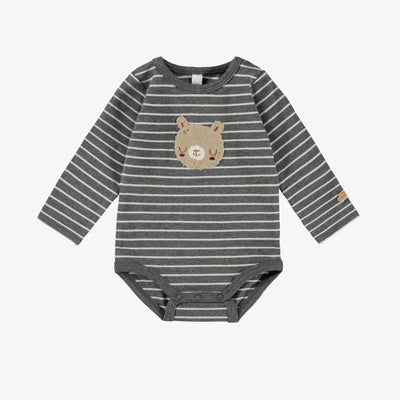 Cache-couche gris à rayures, naissance