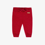 Pantalon rouge en tricot, naissance
