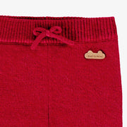 Zoom détails du pantalon rouge en tricot, naissance