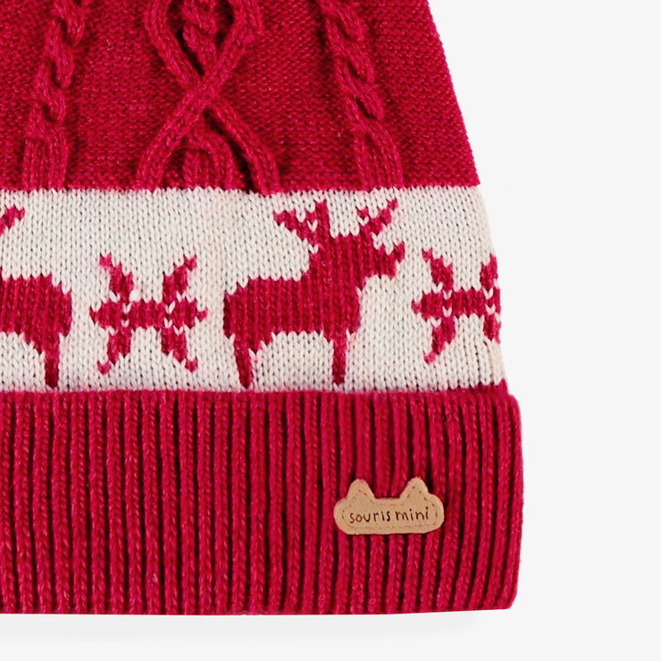 Bonnet rouge à motifs jacquard, naissance