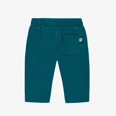 Dos du pantalon turquoise style jogger, bébé