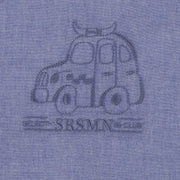 Détail de la chemise bleu chiné en coton chambray, bébé