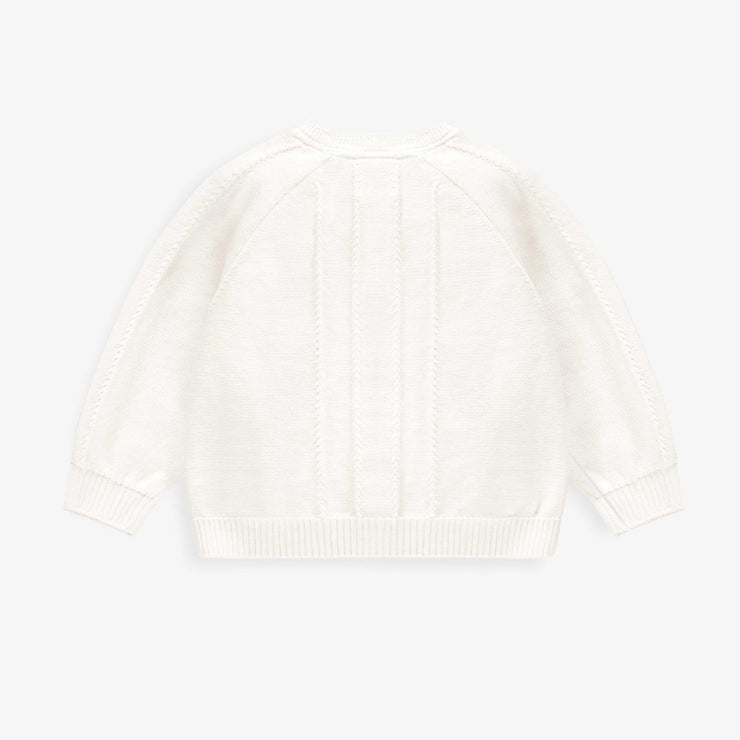 Dos du cardigan blanc en tricot avec détails ajourés et fleurs crochetées, bébé
