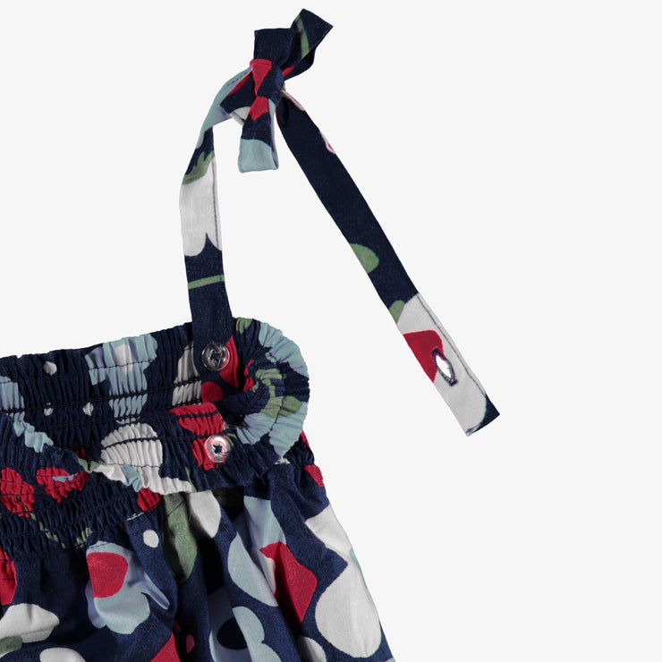 Détail de la robe marine à motifs de fleurs, enfant