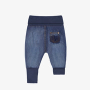 Dos du pantalon évolutif en denim bleu moyen à effet délavé, naissance