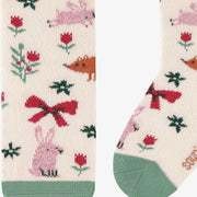 Zoom chaussettes crème à motifs festifs, bébé